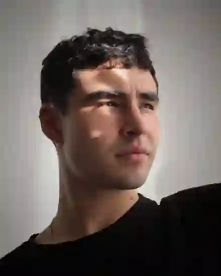 First input photo: a young man in a black t-shirt, front-facing